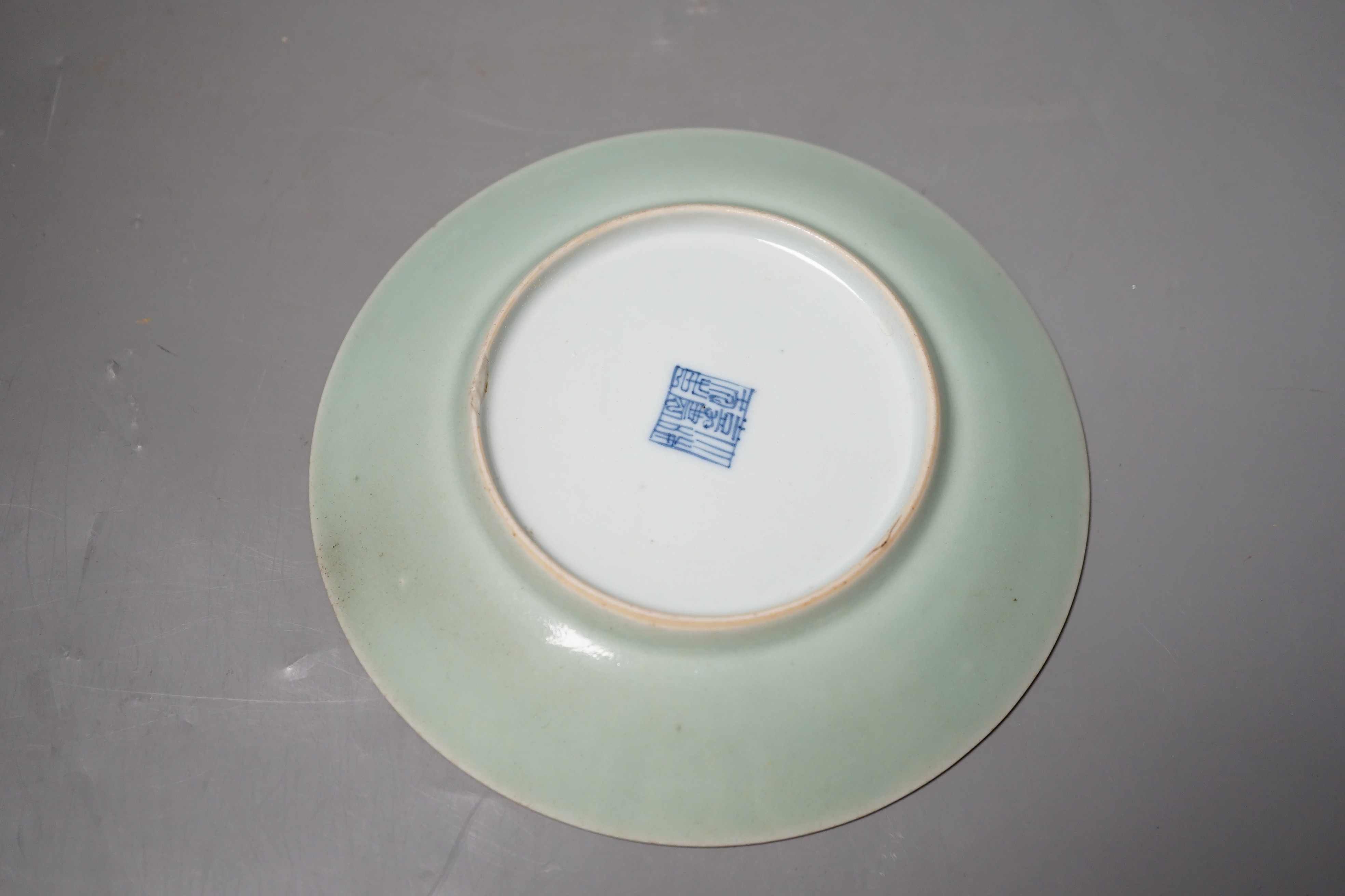 A Chinese blue and white celadon glazed dish, Qianlong seal mark, but 19th century, 15cm diameter